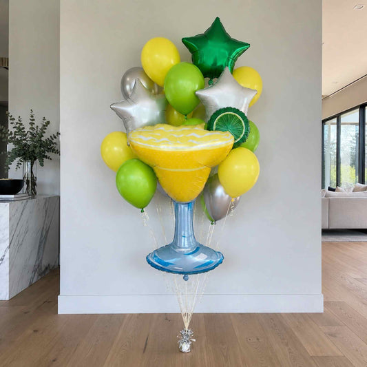 Balloon arrangement shaped like a margarita glass with colorful balloons in a room.