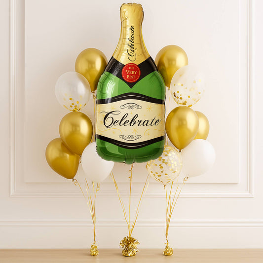 Balloons shaped like a champagne bottle with 'Celebrate' text against a white wall.