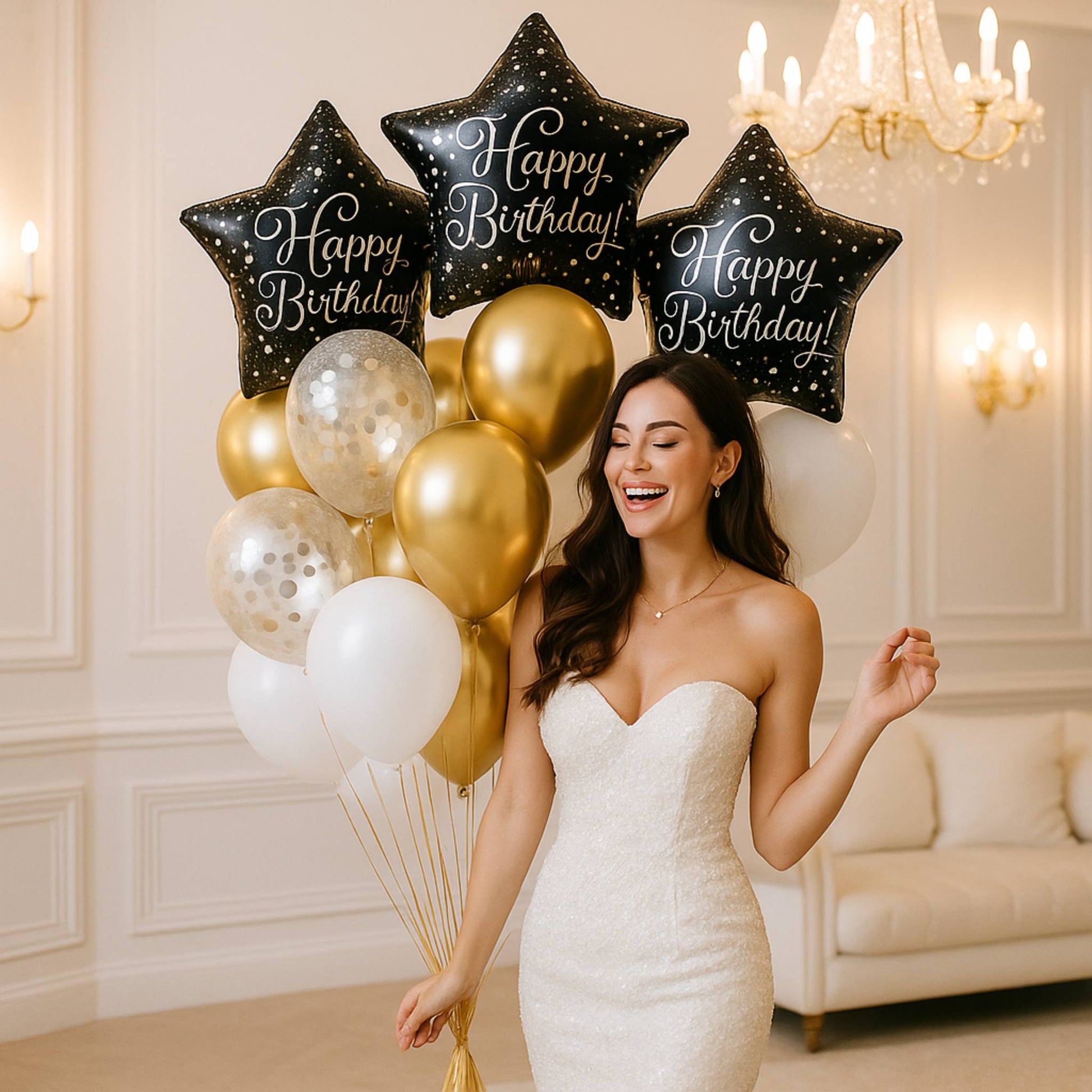 Woman in a white dress holding birthday balloons in a decorated room