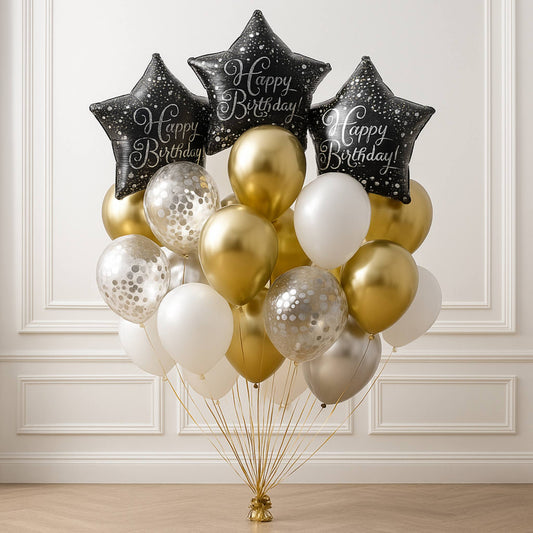 Bouquet of balloons with 'Happy Birthday' stars against a white wall.