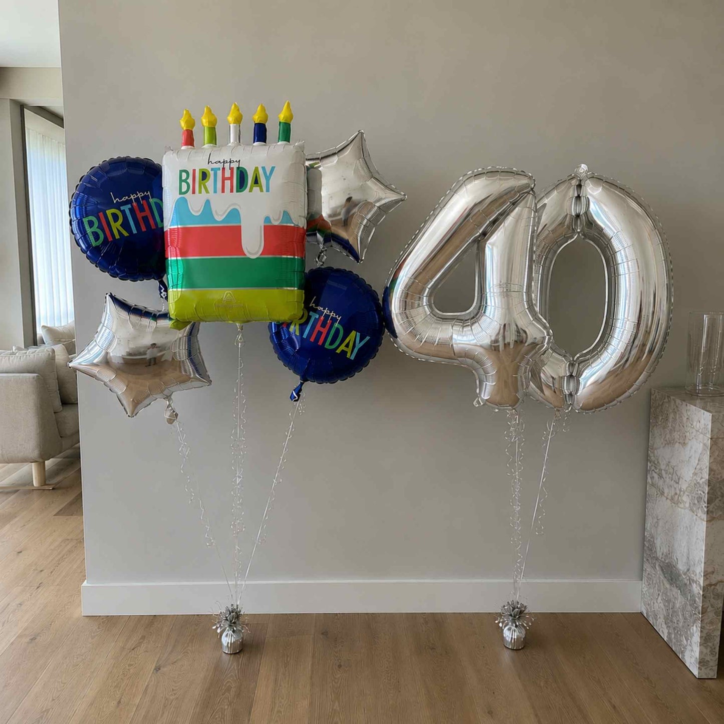 A tiny bit older birthday cake balloon bouquet