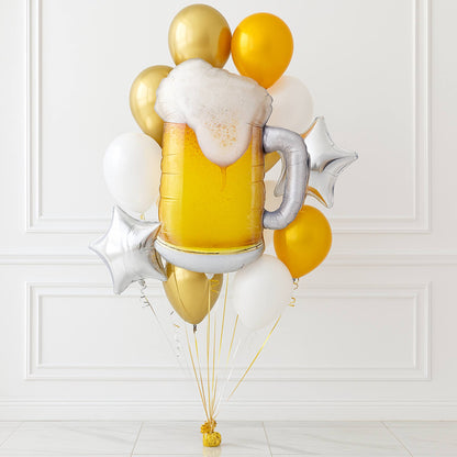 Balloon bouquet shaped like a beer mug with gold and yellow balloons on a white background