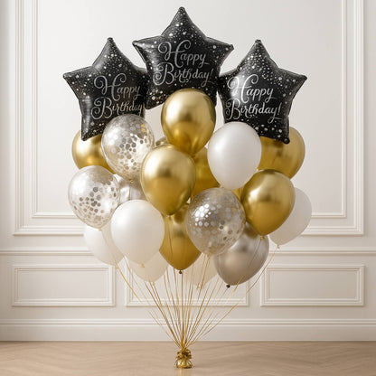 Bouquet of balloons with 'Happy Birthday' stars against a white wall.