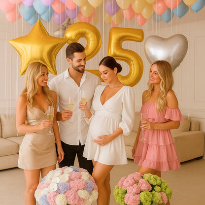 Group of people celebrating a 25th anniversary with balloons and flowers.