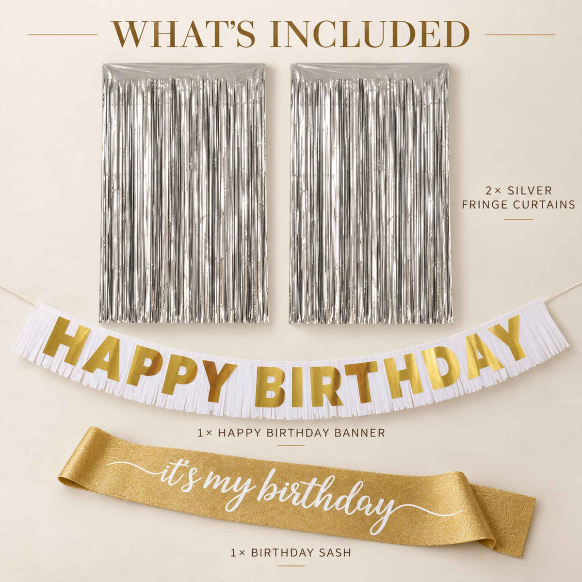 A birthday party decoration set shown on a light beige background with text labels. The set includes two silver fringe curtains, a white 'HAPPY BIRTHDAY' banner with gold lettering, and a gold sash that reads 'it's my birthday'.